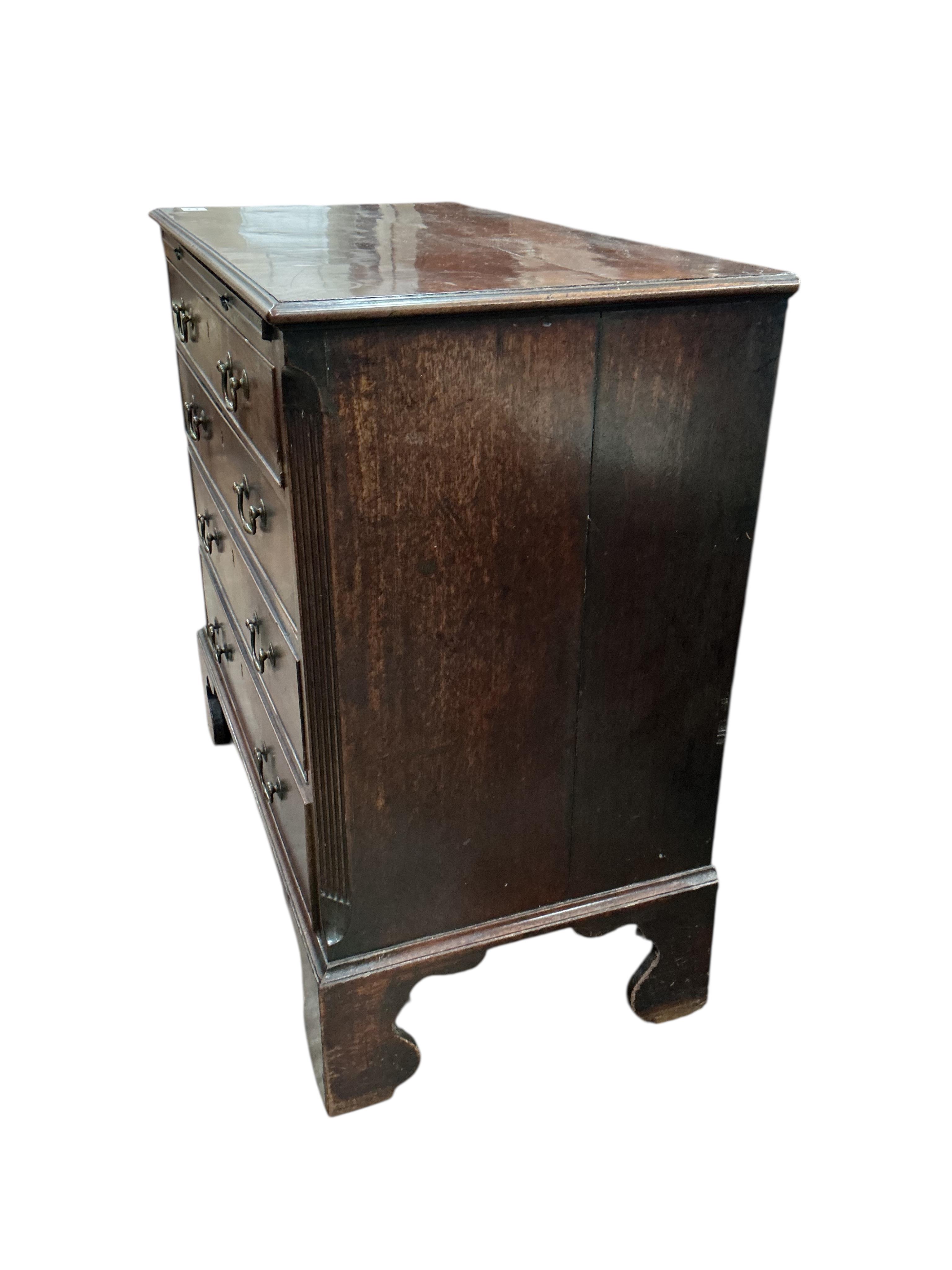 A George III mahogany chest of four drawers with brushing slide, width 87cm, depth 46cm, height 86cm